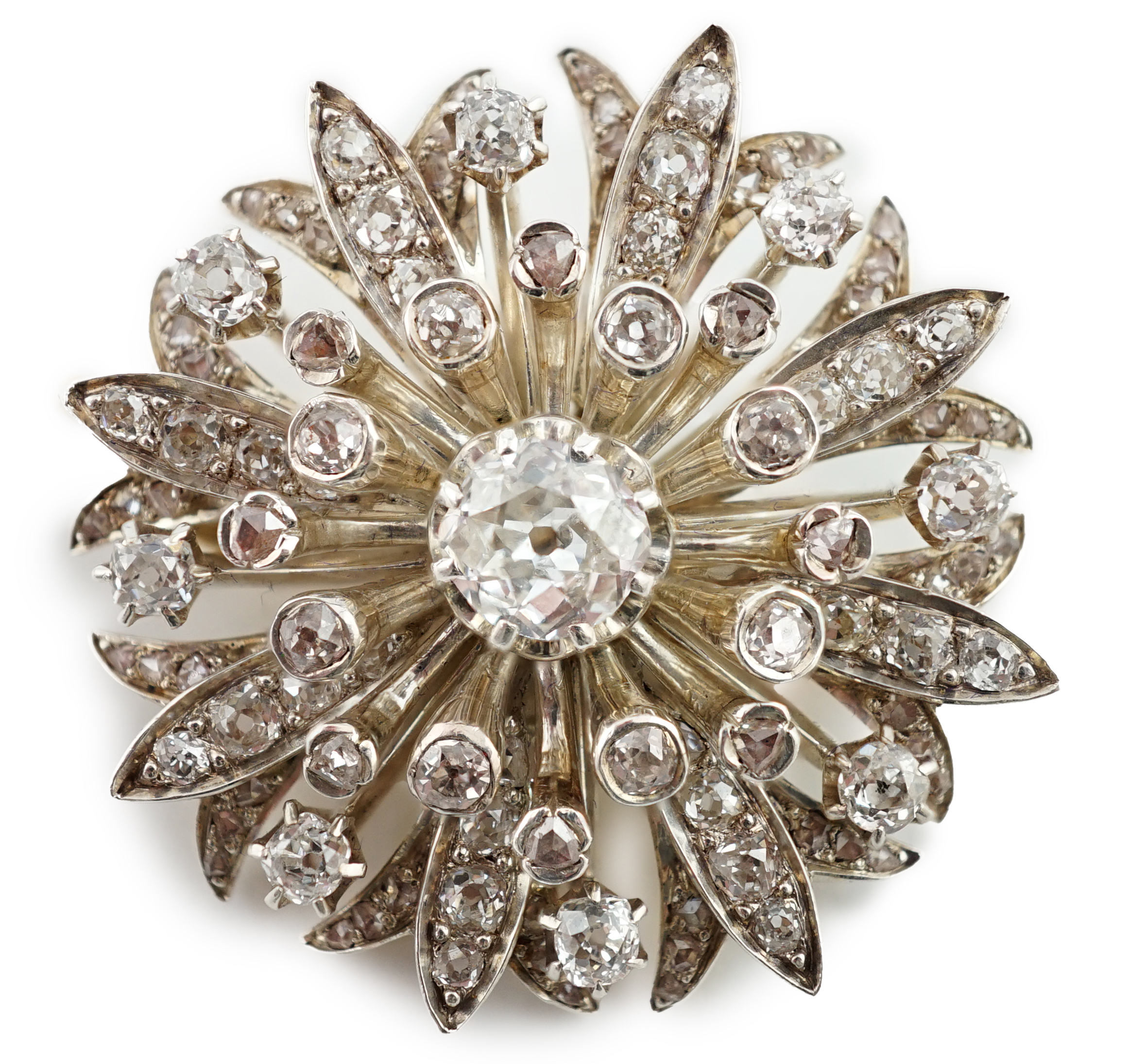 A late Victorian gold and diamond foliate starburst pendant brooch